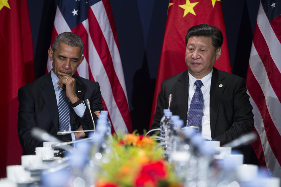 President Barack Obama, left, meets with Chinese President Xi Jinping during the COP21, United Nations Climate Change Conference, in Le Bourget, outside Paris, on Monday, Nov. 30, 2015. (AP Photo/Evan Vucci)