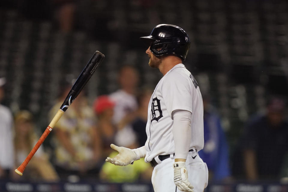 Detroit Tigers' Robbie Grossman flips his bat after striking out during the 10th inning of a baseball game against the Chicago White Sox, Friday, June 11, 2021, in Detroit. (AP Photo/Carlos Osorio)