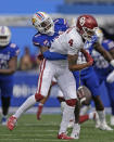 Kansas cornerback Cobee Bryant (2) breaks up a pass intended for Oklahoma wide receiver Nic Anderson (4) during the first half of an NCAA college football game Saturday, Oct. 28, 2023, in Lawrence, Kan. (AP Photo/Charlie Riedel)