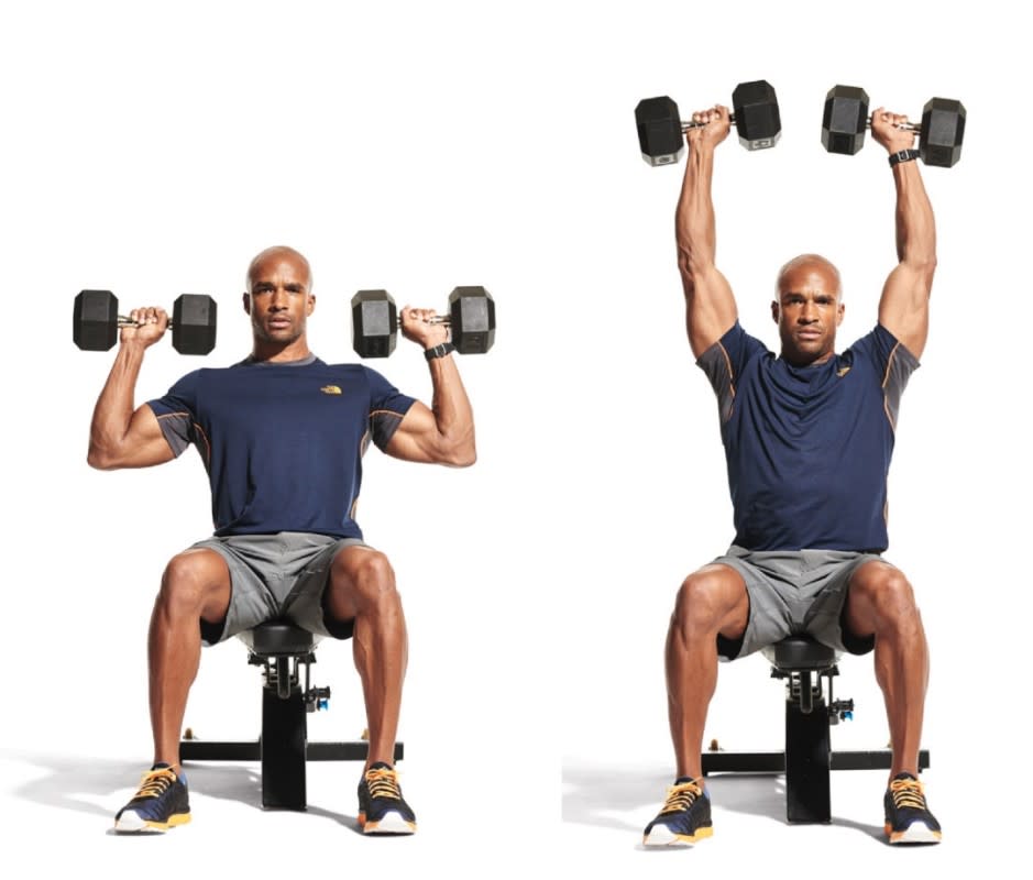 <p>Sit on a bench and hold dumbbells on your thighs, to start. "Kick" the dumbbells up to your shoulders or simply bring them slowly to shoulder level. Squeeze your shoulder blades together and stabilize your core as you press the weights overhead and slightly backward so they're vertically aligned with the back of your head. Hold at the top for a moment, then lower back to your shoulders. That's 1 rep. Repeat. </p>