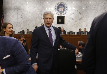 U.S. Supreme Court nominee judge Neil Gorsuch returns from a break in his testimony at his Senate Judiciary Committee confirmation hearing on Capitol Hill in Washington, U.S., March 21, 2017. REUTERS/Jonathan Ernst