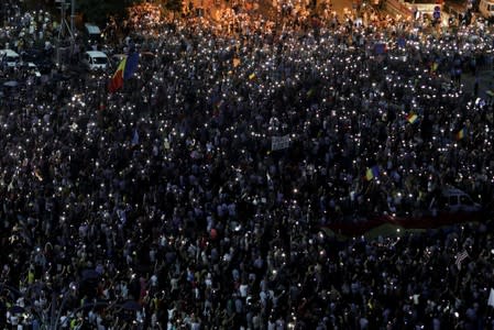 Thousands of people protest against the Romanian government in central Bucharest