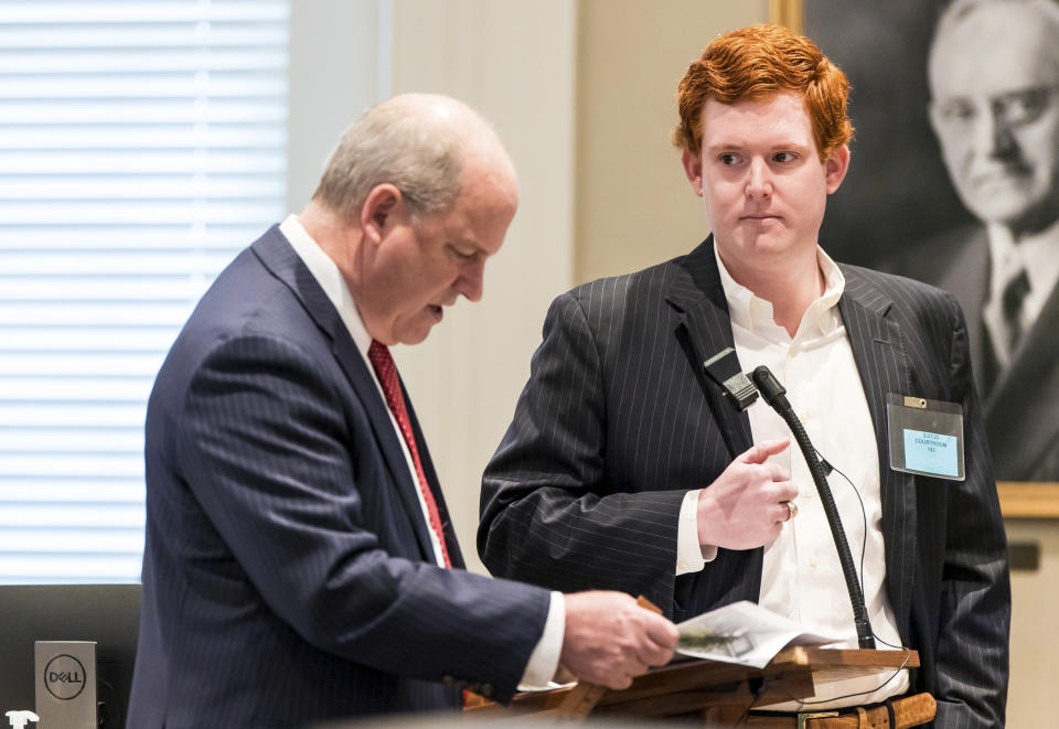 Buster Murdaugh, right, the son of Alex Murdaugh, listens to a question from defense attorney Jim Griffin while testifying during his father's trial at the Colleton County Courthouse in Walterboro, S.C., on Tuesday, Feb. 21, 2023. The 54-year-old attorney is standing trial on two counts of murder in the shootings of his wife and son at their Colleton County, S.C., home and hunting lodge on June 7, 2021. (Jeff Blake/The State via AP, Pool)