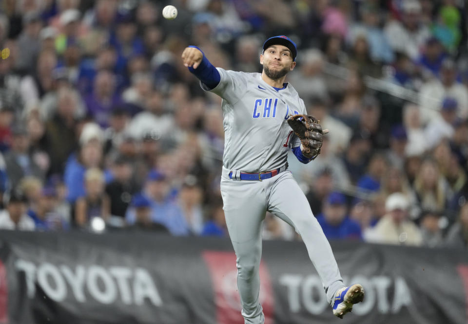 Chicago Cubs third baseman Nick Madrigal throws to first base to put out Colorado Rockies' Ezequiel Tovar to end the third inning of a baseball game Monday, Sept. 11, 2023, in Denver. (AP Photo/David Zalubowski)