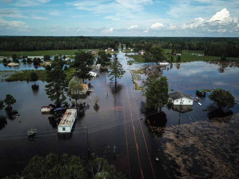 A flooded neighborhood stands next to the Lumber River in Lumberton.&nbsp;