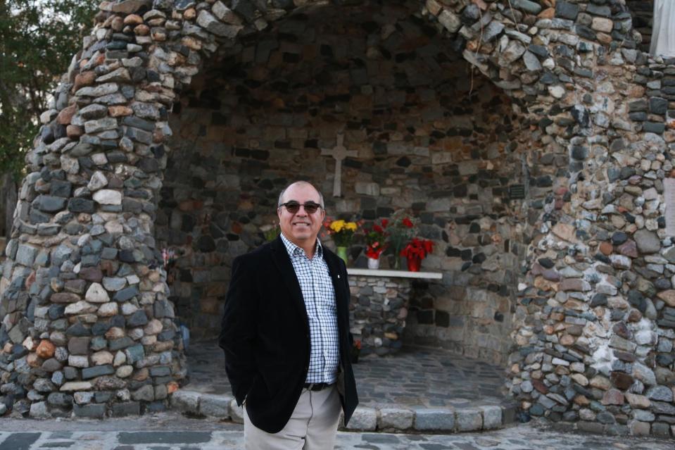 Chon Magana stands in front of the grotto outside Our Lady of Lourdes Catholic Church in Port Wentworth. Magana is the president of the Our Lady of Guadeloupe Festival and an active member of the church.