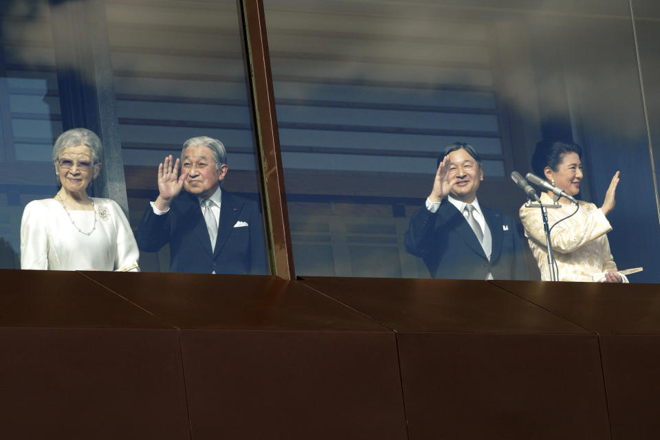 Japan's Emperor Naruhito, second from right, waves with Empress Masako, right, Empress Emerita Michiko and Emperor Emeritus Akihito to well-wishers from the bullet-proofed balcony during a public appearance with his imperial families at Imperial Palace in Tokyo Thursday, Jan. 2, 2020, in Tokyo. (AP Photo/Eugene Hoshiko)