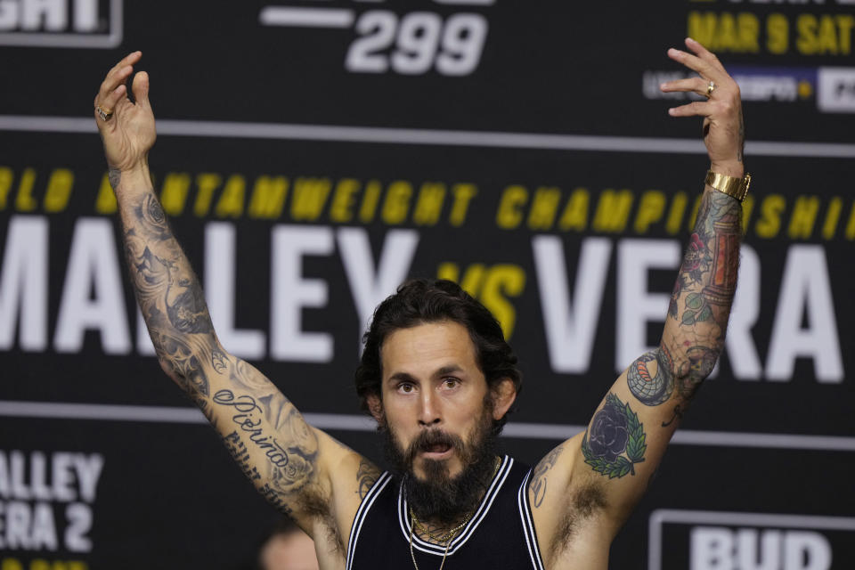 Marlon Vera waves to the crowd as he is introduced during a news conference for UFC 299, Thursday, March 7, 2024, in Miami. Vera is scheduled to face Sean O'Malley on Saturday in a bantamweight mixed martial arts bout. (AP Photo/Wilfredo Lee)