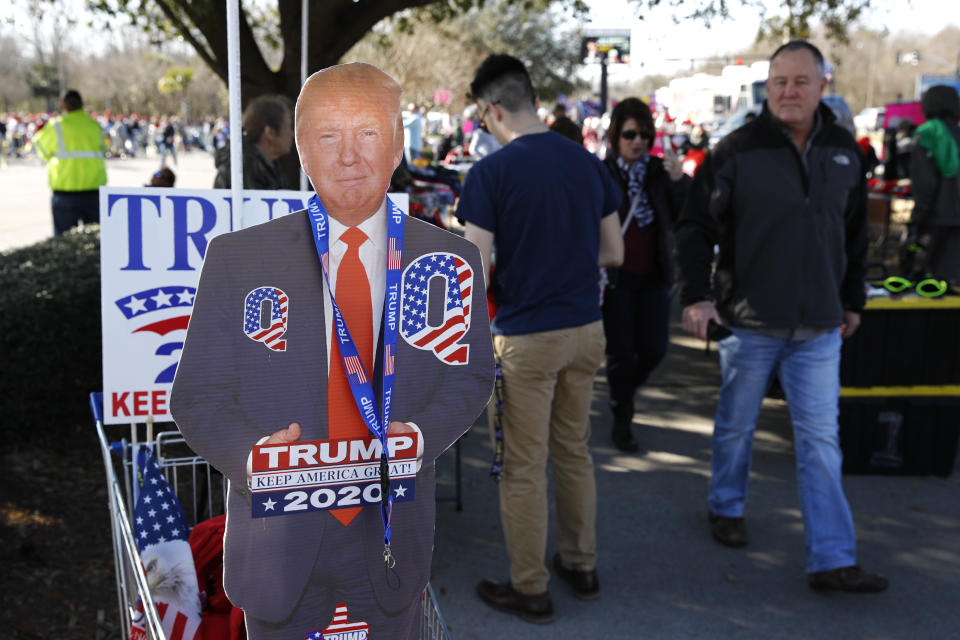 Attendees gather outside a campaign rally for President Donald Trump, Friday, Feb. 28, 2020, in North Charleston, S.C. (AP Photo/Patrick Semansky)