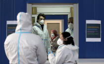 A medical workers works in a COVID-19 set up for rapid new coronavirus testing in Vienna, Austria, Monday, Nov. 30, 2020. The Austrian government has moved to restrict freedom of movement for people, in an effort to slow the onset of the COVID-19 disease and the spread of the coronavirus. (AP Photo/Ronald Zak)