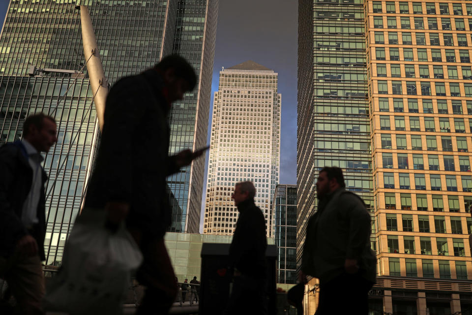 People walk through the Canary Wharf financial district of London, Britain, December 7, 2018. REUTERS/Simon Dawson