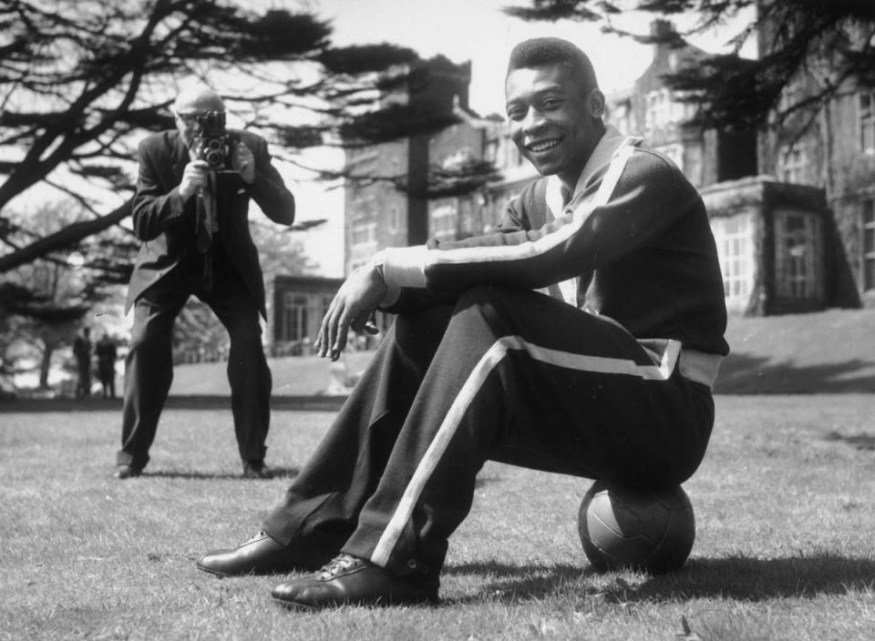 7th May 1963: Star of the Brazilian football team, Pele sits on the ball during a break in training at Selsdon Park Hotel where they were staying. The Brazilians were to play England at Wembley (Getty Images)