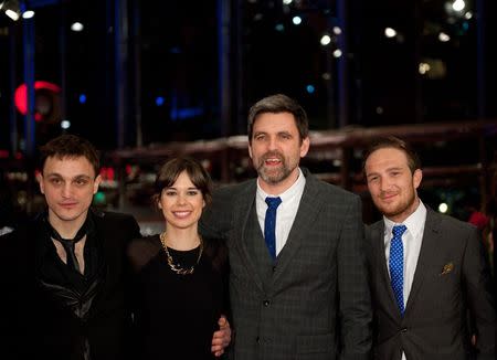 Director Sebastian Schipper (2nd R) and cast members, Franz Rogowski (L-R), Laia Costa and Frederick Lau, arrive on the red carpet for the screening of the in competition movie "Victoria" at the 65th Berlinale International Film Festival in Berlin February 7, 2015. REUTERS/Stefanie Loos