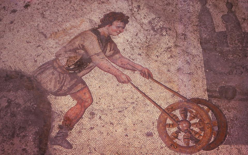 Not a prototype lawnmower, but a wheel-trundling sport depicted in a Byzantine mosaic - CM Dixon/Getty Images