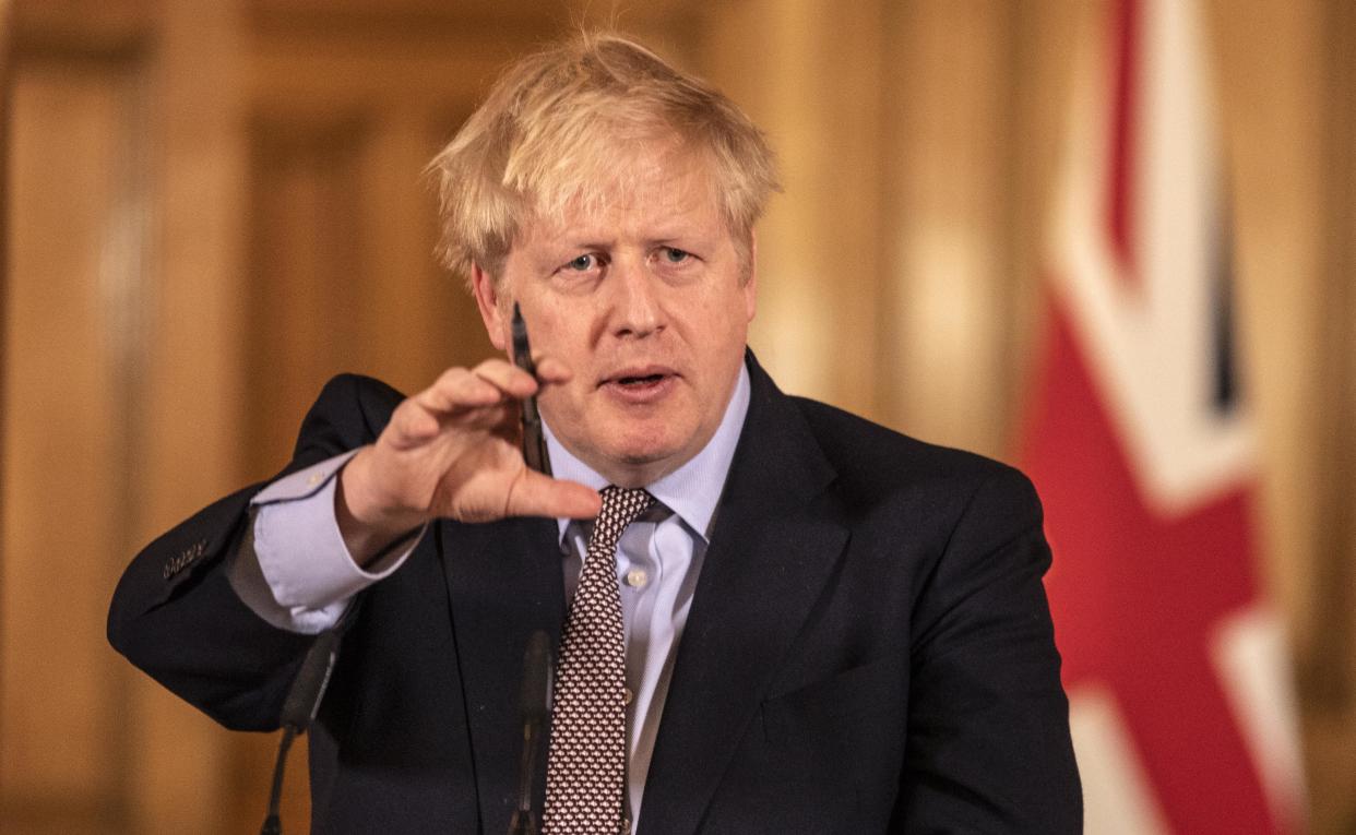 Prime Minister Boris Johnson gives a press conference on the ongoing COVID-19 situation in London on March 16, 2020. (Photo by Richard Pohle / POOL / AFP) (Photo by RICHARD POHLE/POOL/AFP via Getty Images)
