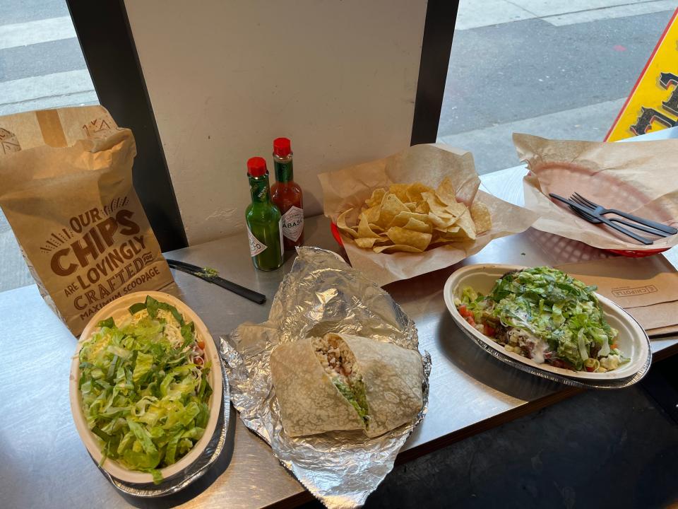 tiffany's chipotle order sitting on a table near a window