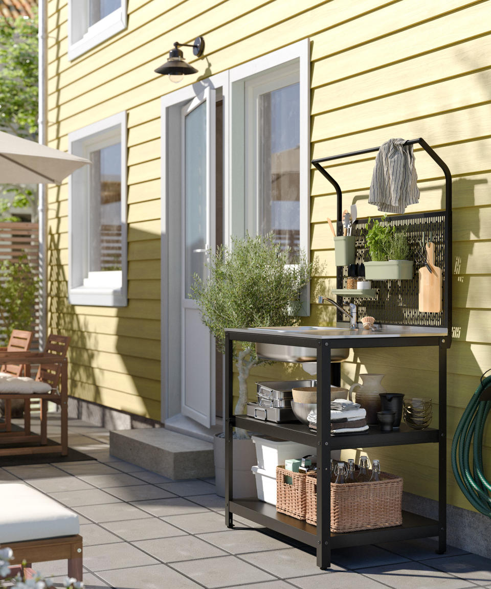 small freestanding outdoor sink and kitchen unit on a patio