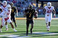 Missouri running back Tyler Badie scores on a touchdown run during the second half of an NCAA college football game against Arkansas Saturday, Dec. 5, 2020, in Columbia, Mo. Missouri won the game 50-48. (AP Photo/L.G. Patterson)