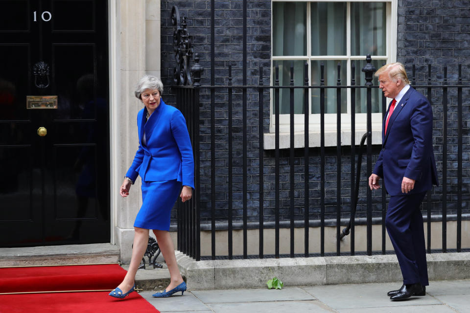 (left to right) Prime Minister Theresa May welcoming US President Donald Trump to Downing Street, London, on the second day of his state visit to the UK.