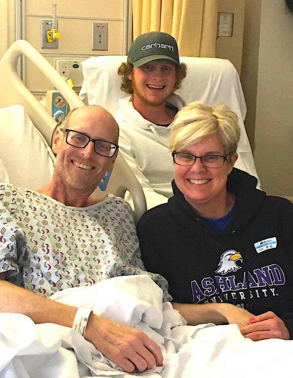 Nevin Mishler, his wife Kari and their son Carter, a member of the Ashland University golf team, share some family time last summer at MetroHealth in Cleveland.