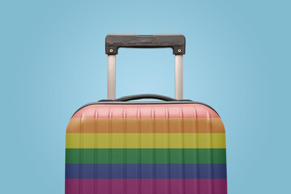 A suitcase with rainbow flag design.