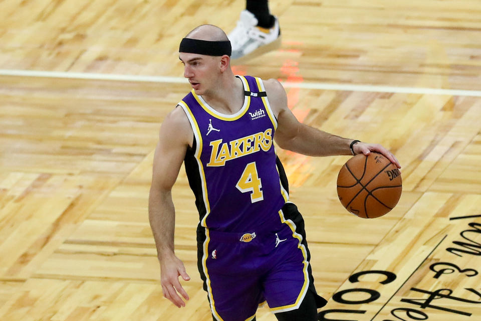  Alex Caruso #4 of the Los Angeles Lakers controls the ball against the Orlando Magic at Amway Center on April 26, 2021 in Orlando, Florida. NOTE TO USER: User expressly acknowledges and agrees that, by downloading and or using this photograph, User is consenting to the terms and conditions of the Getty Images License Agreement. (Photo by Alex Menendez/Getty Images)