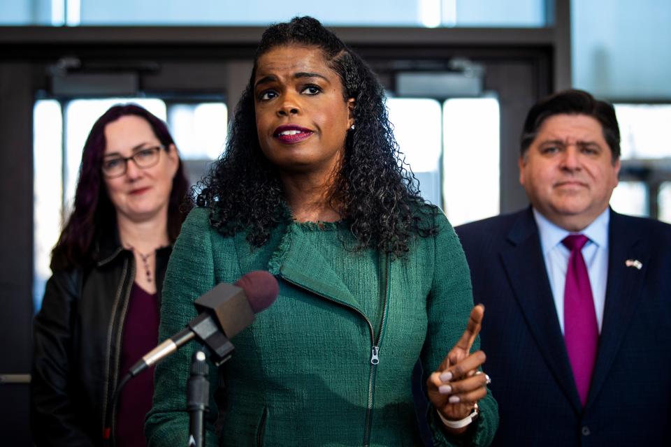 State Rep. Kelly Cassidy and Illinois Gov. J.B. Pritzker look on as Cook County State's Attorney Kim Foxx speaks during a press conference in Chicago after Foxx filed motions to vacate more than 1,000 low-level cannabis convictions, Wednesday, Dec. 11, 2019.