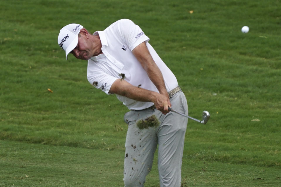 Lucas Glover hits his approach shot to the ninth hole during the final round of the Wyndham Championship golf tournament in Greensboro, N.C., Sunday, Aug. 6, 2023. (AP Photo/Chuck Burton)