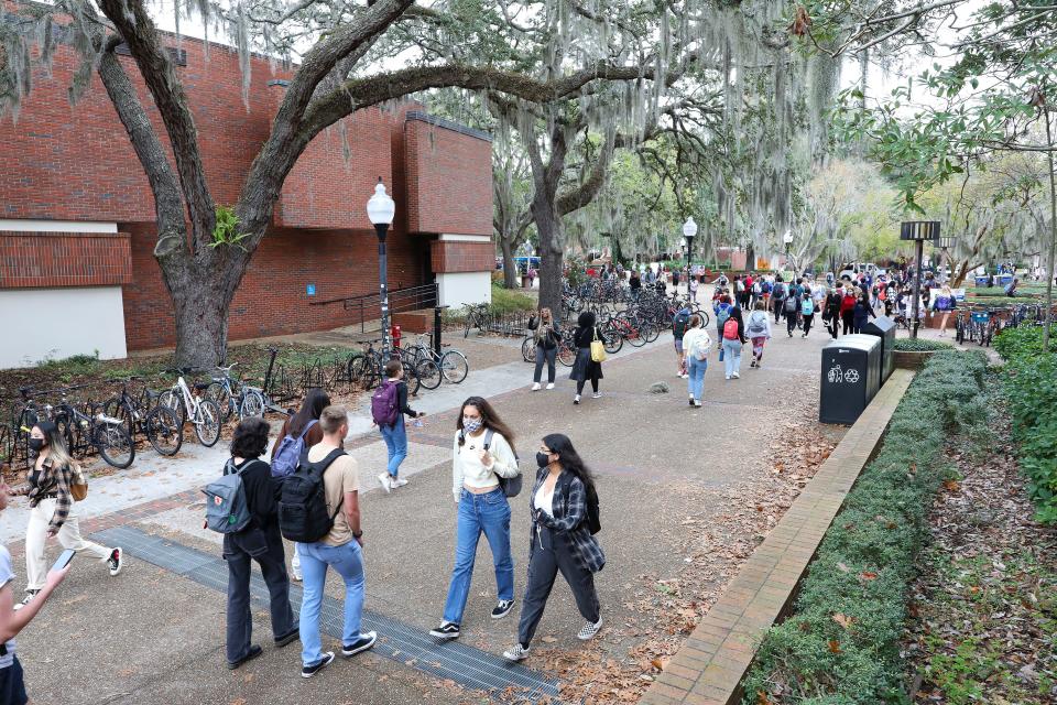 Students walk through Turlington Plaza on the University of Florida campus as the spring 2022 semester begins at the university, in Gainesville Jan 5, 2022.