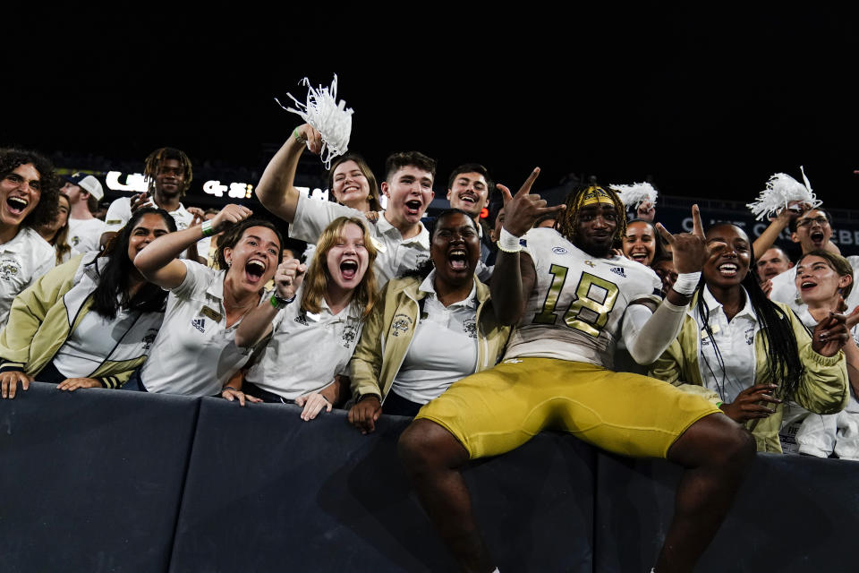 Georgia Tech tight end Peje' Harris (18) celebrates in the stands after the team's win against Western Carolina in an NCAA college football game Saturday, Sept. 10, 2022, in Atlanta. (AP Photo/Brynn Anderson)