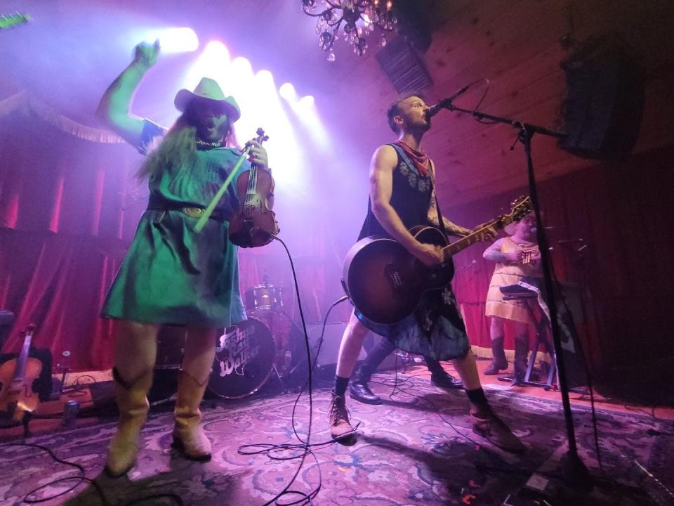 Texas-based band the Vandoliers wear dresses as they perform at The Shed in Maryville, Tennessee, the day Gov. Bill Lee signed a bill that limits "male and female impersonators" to age-restricted venues in Tennessee. The dresses were auctioned on the band's Instagram, with $2,277.69 in proceeds supporting Knox Pride and the Tennessee Equality Project