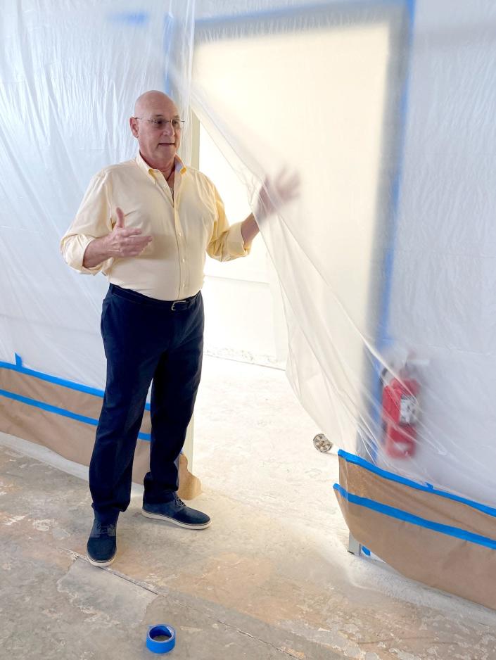 Stephen Fett, president and CEO of the Panama City Rescue Mission, walks through the organization's homeless men's shelter, which is still undergoing renovations after Hurricane Michael.