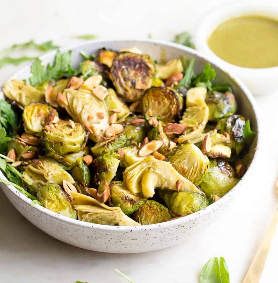 <p>You may not think of “salad” when you consider Thanksgiving dinner, but it’s a good way to get in greens. This Brussels sprouts salad from <a href="https://www.wholesomelicious.com/roasted-brussels-sprouts-salad-with-mustard-basil-vinaigrette/" rel="nofollow noopener" target="_blank" data-ylk="slk:Wholesomelicious" class="link ">Wholesomelicious </a>is perfect, as it has crunch from almonds and a spicy kick from the Dijon mustard, and it’s still low-carb.</p>