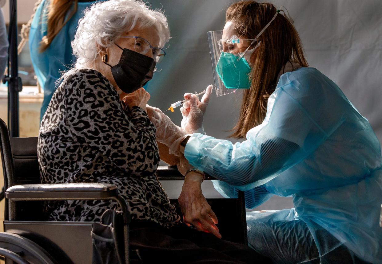 Long-term care facility resident Frances Watland receives the first COVID-19 vaccination for Oklahoma nursing home residents and staff on Dec. 22, 2020.