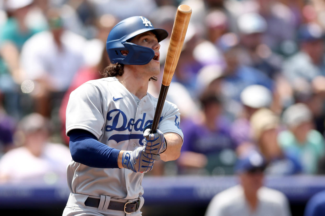 DENVER, COLORADO - JULY 31: James Outman #77 of the Los Angeles Dodgers hits a two RBI home run in his Major League Baseball debut against the Colorado Rockies in the third inning at Coors Field on July 31, 2022 in Denver, Colorado. (Photo by Matthew Stockman/Getty Images)