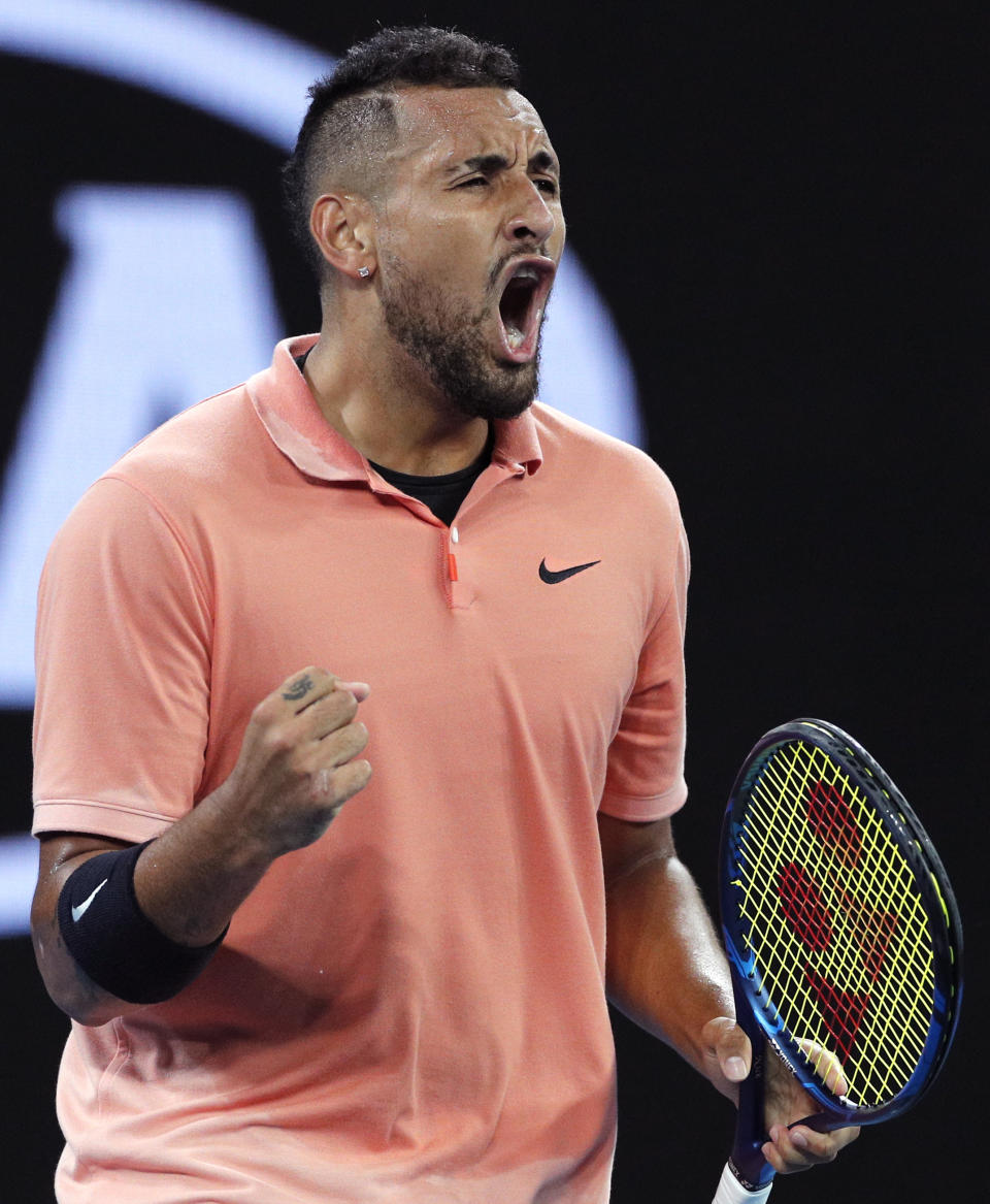 Australia's Nick Kyrgios reacts after winning a point over Italy's Lorenzo Sonego during their first round singles match at the Australian Open tennis championship in Melbourne, Australia, Tuesday, Jan. 21, 2020. (AP Photo/Andy Wong)