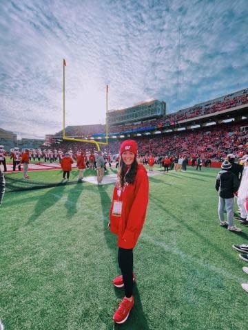 Kelsey Tehan is shown here on the sidelines of Camp Randall Stadium during her time as a University of Wisconsin-Madison student. During that time, she worked an internship in brand communications for the athletic department.