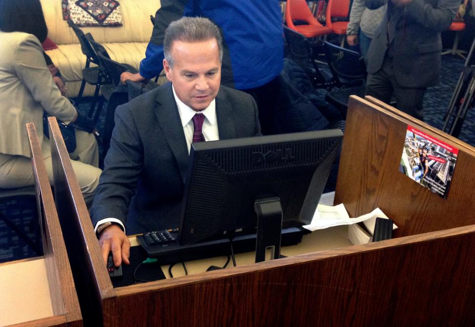 In this March 2018 photo, U.S. Rep. David Cicilline completes his census form on a computer at a library in Providence, R.I., during the nation's only test run of the 2020 Census. The U.S. Census Bureau began using new high-tech tools in attempts to get a more accurate population count as it faced criticism for how it reaches out to people of color.