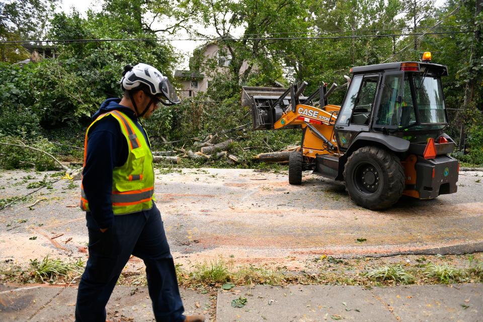 City of Greenville arborists work to clean up a fallen tree limb that left 71 residents with out power due to gusts of wind from Hurricane Ian near the corner of Elizabeth Street and Garraux Street on Friday, September 30, 2022.