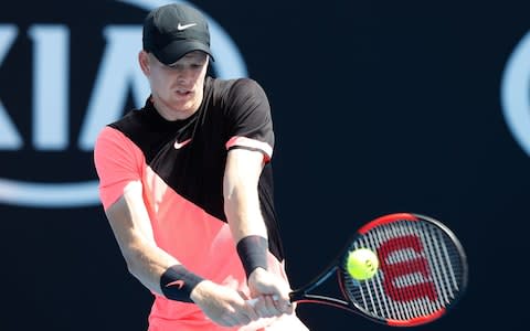 Kyle Edmund of Great Britain plays a backhand in his first round match against Kevin Anderson of South Africa on day one of the 2018 Australian Open at Melbourne Park on January 15, 2018 in Melbourne, Australia - Credit: Getty Images 