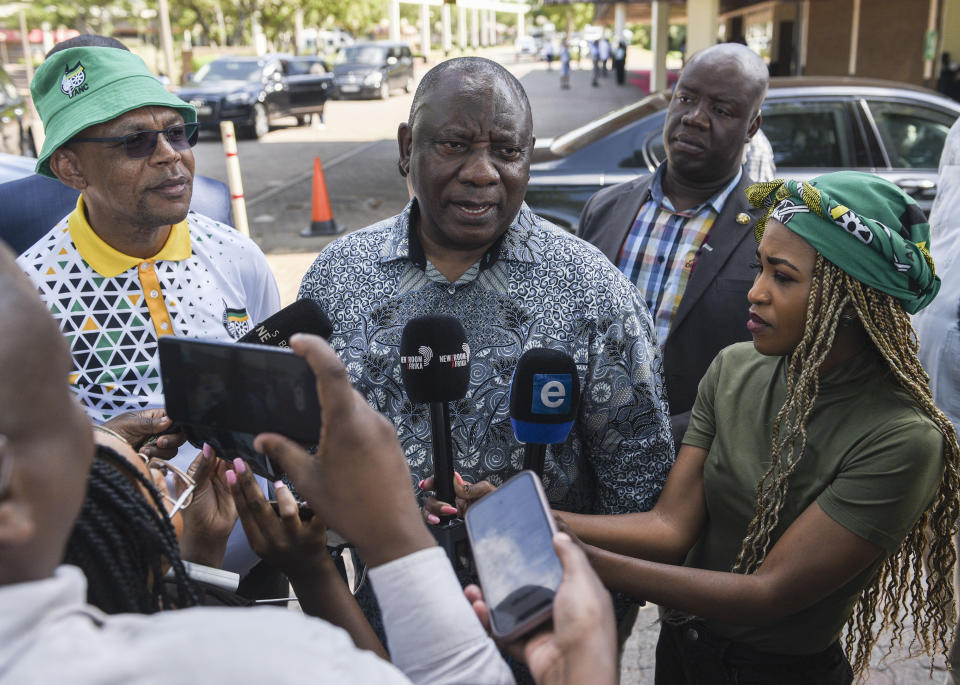 South African President Cyril Ramaphosa speaks to the media after leaving an African National Congress (ANC) National Executive Committee meeting in Johannesburg, Sunday, Dec. 4, 2022. The meeting is being held to discuss the future of Ramaphosa as calls continue for his resignation over a scandal over money stolen from his farm. (AP Photo)