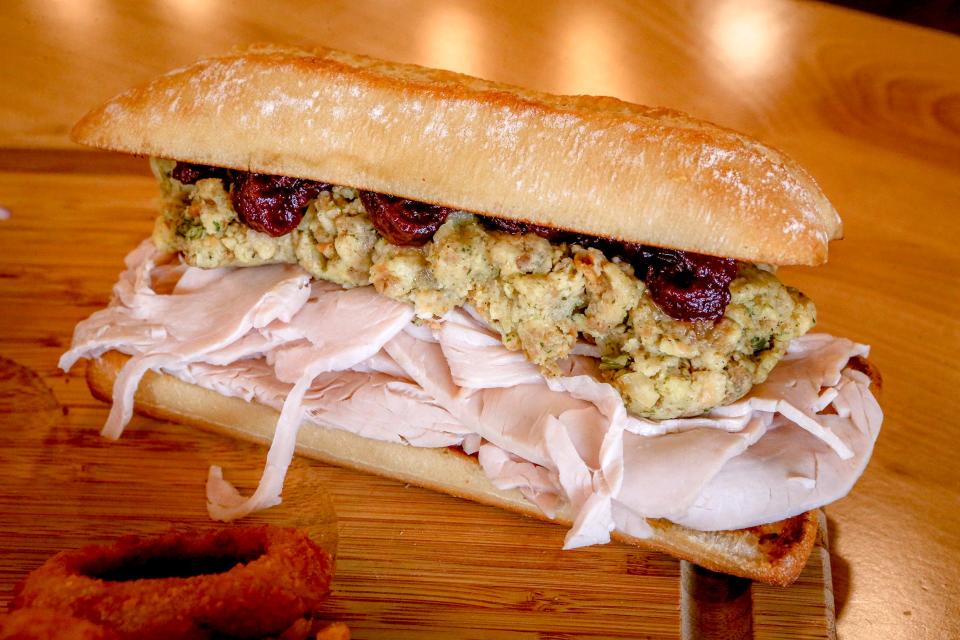 The Thanksgiving sandwich has a quarter pound of roasted turkey, plus stuffing, cranberry and mayonnaise, and a side of gravy for dipping.