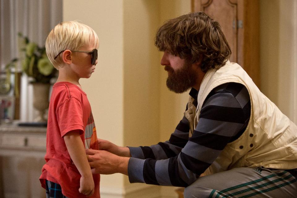 This film publicity image released by Warner Bros. Pictures shows Grant Holmquist as Tyler/Carlos, left, and Zach Galifianakis as Alan in a scene from "The Hangover Part III." (AP Photo/Warner Bros. Pictures)