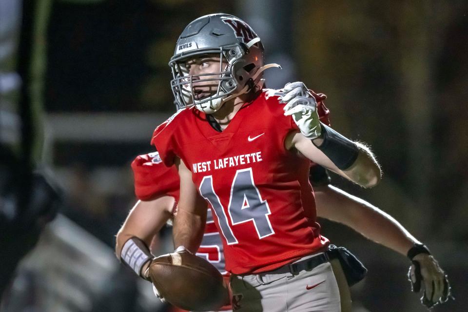 West Lafayette senior Cooper Kitchel (14) scores late during the IHSAA 3A football sectional 25 championship game against the Hanover Central Wildcats, Friday, Nov. 3, 2023, at West Lafayette High School’s Gordon Straley Field in West Lafayette, Ind. West Lafayette won in OT 42-41.