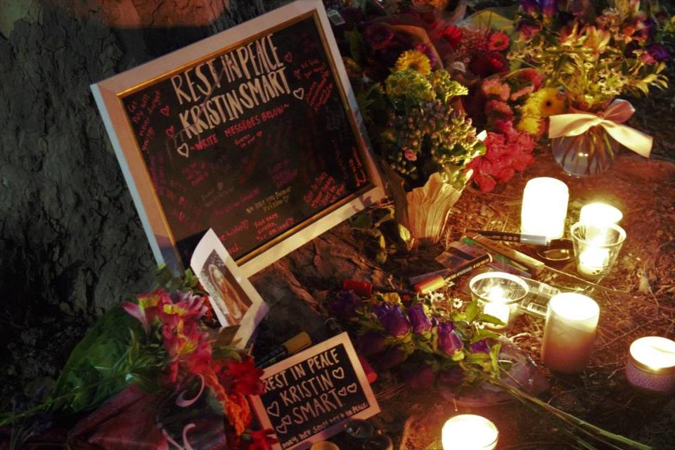 Cal Poly students laid out flowers, lit candles, burned essence and wrote well-wishing notes on a chalkboard to Kristin Smart and her family during a candlelight vigil on April 13, 2021. Students said they wanted to pay their respects to Smart and honor her memory on the day that Paul Flores was arrested on suspicion of the former university student’s murder.