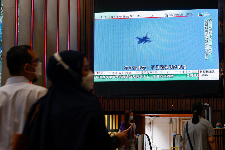 A TV screen shows that China's military started exercises including live firing on the waters and the airspace surrounding Taiwan, as reported by Chinese state television, in Hong Kong, China August 4, 2022. / Credit: TYRONE SIU / REUTERS