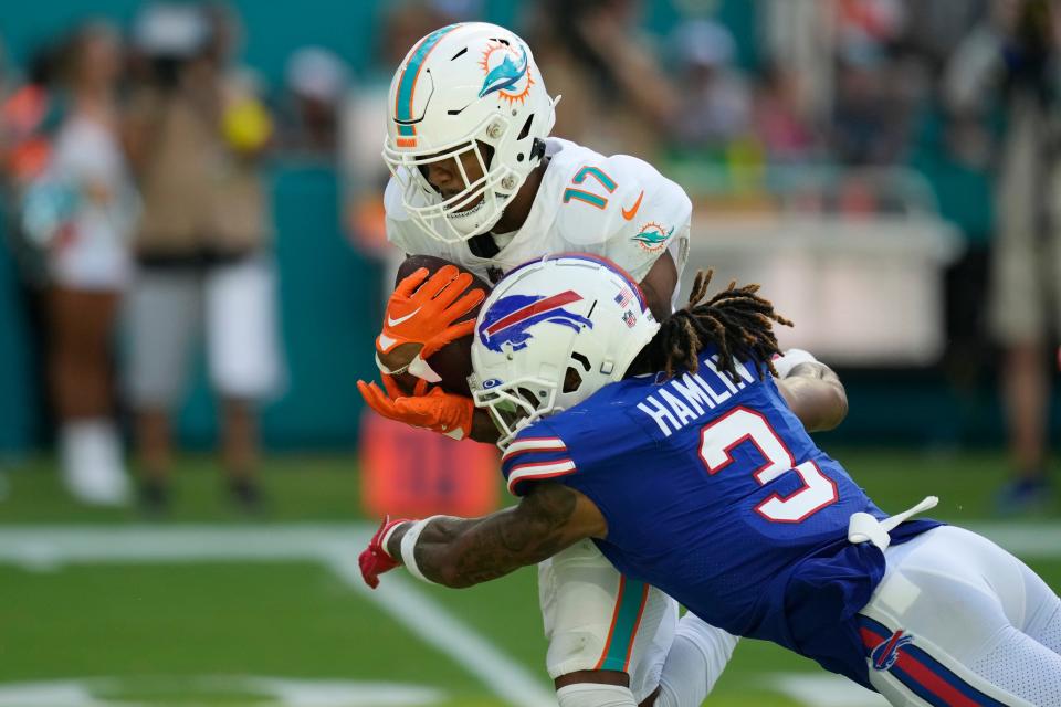 Buffalo Bills safety Damar Hamlin (3) tackles Miami Dolphins wide receiver Jaylen Waddle (17) during the second half of an NFL football game, Sunday, Sept. 25, 2022, in Miami Gardens, Fla. Waddle has consecutive 100-plus yard receiving games.