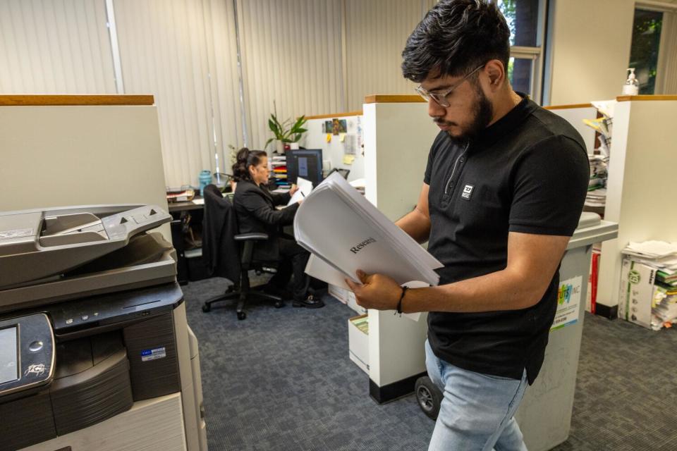 Maria Del Pilar Barradas-Medel and her son Alexander work in a law office in Arcadia, CA.