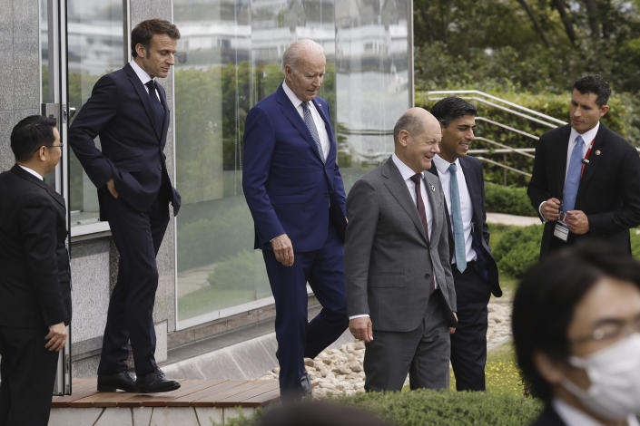 U.S. President Joe Biden, center left, France's President Emmanuel Macron, second left, German Chancellor Olaf Scholz, center right, and British Prime Minister Rishi Sunak, second right, walk to participate in a family photo with G7 leaders before their working lunch meeting on economic security during the G7 summit, at the Grand Prince Hotel in Hiroshima, western Japan Saturday, May 20, 2023. (Jonathan Ernst/Pool Photo via AP)