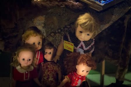 Vintage dolls are for sale at a stall at Boroichi flea market in Tokyo December 15, 2014. In the 16th century, REUTERS/Thomas Peter